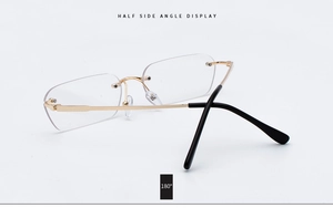 Detail of rimless sunglasses featuring 180 degree flexible hinges and gold metal frames