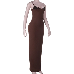 Close-up of sequin patchwork on the bust of a dark brown slim-fit long dress