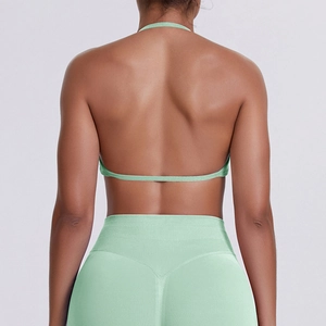 Detail of mint green seamless high-stretch sports bra with halter neck and back strap design