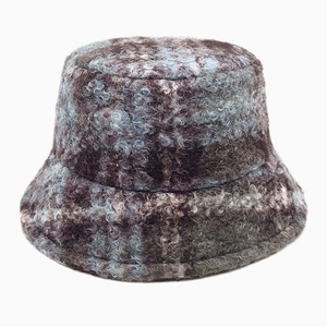 Close-up of mixed grey and blue plaid lamb wool bucket hat with soft fuzzy texture