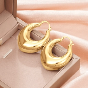 Minimalist thick gold teardrop hoop earrings with high-polished mirror finish in jewelry box
