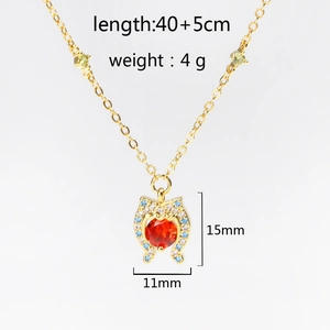 Detail view of heart-shaped pendant with red zircon and dimensions of 15mm by 11mm