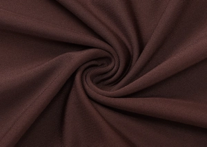 Detail of dark chocolate ribbed fabric showing elegant texture and elastic drape