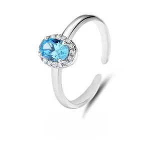 Close-up of S925 sterling silver ring featuring an oval blue stone with diamond halo