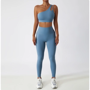 Detail view of one-shoulder yoga bra with cutout strap and matching high waist leggings