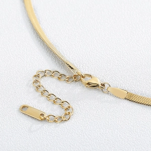 Golden stainless steel flat snake chain necklace with lobster clasp and extension chain