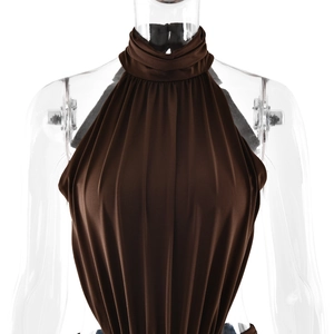 Detailed close-up of dark brown halter neck dress with soft pleated fabric texture