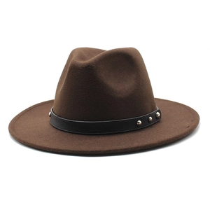Detail of a brown wool fedora hat with a black leather band and silver metal rivets