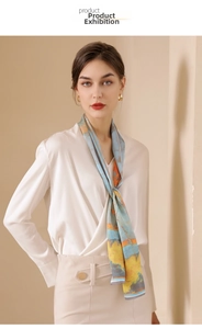 Detail of multi-color oil painting print silk scarf tied on a model with white satin shirt