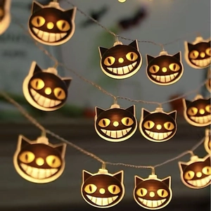 Halloween LED string lights featuring warm glowing black cat heads for festive atmosphere