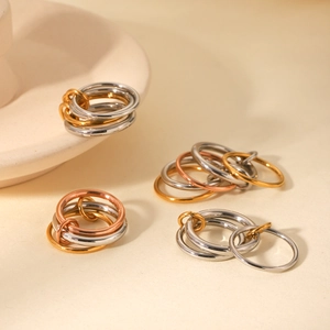 Polished stainless steel stacked rings in gold, silver, and rose gold finishes