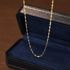Elegant 18K gold S925 sterling silver water wave chain necklace on blue velvet box