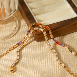 18K gold plated stainless steel bracelet featuring rectangular colored and white zircons