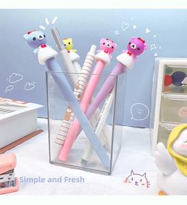 Detail of colorful pens with cute 3D bear figures in a transparent pen holder