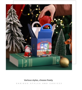 Detail of Christmas gift box with handle featuring festive bus and cartoon cat prints