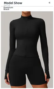 Detail of slim fit black sports jacket with full zipper and thumbhole cuffs design
