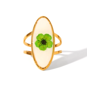 Detailed macro view of 18K gold stainless steel ring with green dried flower oval inlay
