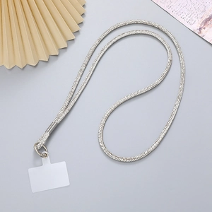 Macro detail of luxury silver rhinestone phone lanyard with metal clip and pad