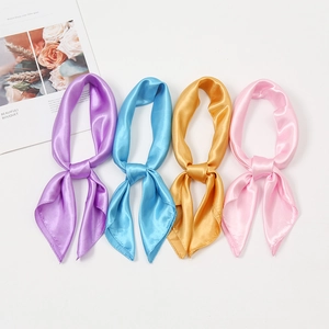 Satin scarves in purple, light blue, gold, and pink with a smooth silk-like finish