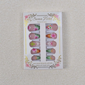 3D floral press-on nails with leopard patterns and rhinestones on almond shape tips