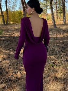 Detail of elegant backless deep purple maxi dress with draped cowl back and long sleeves
