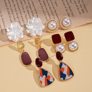 Set of vintage resin pearl flower earrings with geometric metal studs in gold and red