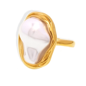 Modern gold irregular ring with large baroque pearl on a white background