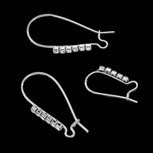 Detailed view of silver stainless steel geometric earrings with sparkling clear rhinestones