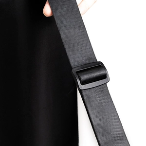 Detail of adjustable black nylon shoulder strap with a sturdy plastic buckle for yoga mat bags