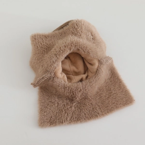 Detailed view of the thickened brown faux fur lining on a winter balaclava hood
