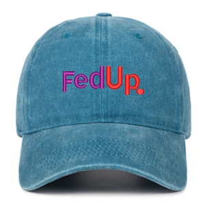 Detailed close-up of rainbow FedUp embroidery on blue washed denim baseball cap