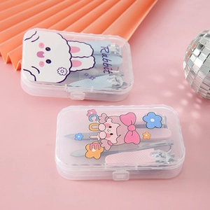 Detail of cute cartoon nail clipper sets in pink and blue storage boxes for kids