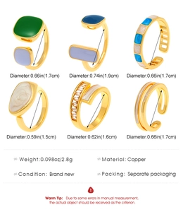 Detailed specs of colorful enamel copper rings with gold coating and crystal details