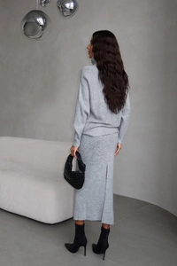 Detail of the back slit and texture on this gray knitted turtleneck skirt set