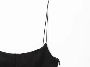 Detail of slim straps and side invisible zipper on a black sexy crop top for women