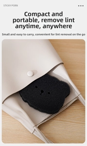 Detail of bear-shaped lint remover sponge with its beige leather snap storage pouch