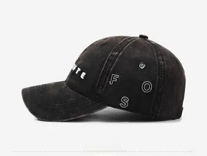 Detailed embroidery with white letters on vintage washed cotton baseball cap