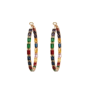 Golden hoop earrings with rainbow colored cubic zirconia stones on white background