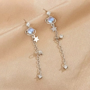 Elegant silver long drop earrings with star and planet pendants on golden silk