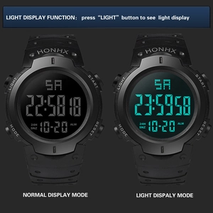 Close-up of dual-mode display showing cyan backlight and large digital watch functions