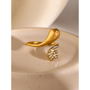 Macro detail of 18k gold plated stainless steel teardrop ring with clear rhinestones