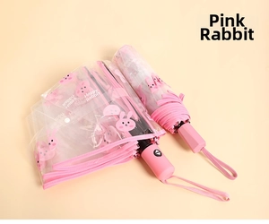 Detail van roze konijnenprint op doorzichtige PVC vouwparaplu met comfortabel mat handvat