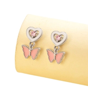 Pink heart and butterfly screw back earrings in stainless steel on a display stand