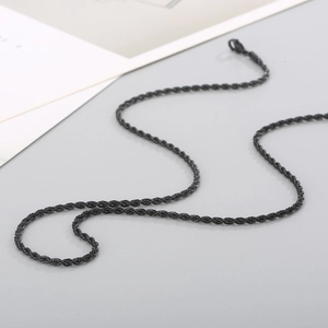 Macro shot of black twisted rope chain in stainless steel with lobster clasp detail