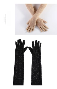 Detailed view of long lace gloves in beige and black with delicate floral pattern