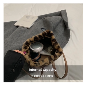Detailed interior view of leopard faux fur bucket bag holding cosmetics and daily items