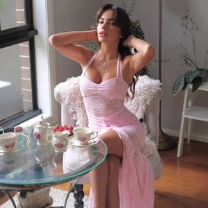Detail of pink lace dress with floral embroidery and sexy semi-sheer halter neck style