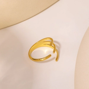 Minimalist gold-plated adjustable three-line ring on a warm geometric pedestal