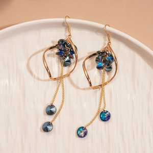 Vintage style gold earrings with blue glass crystals and elegant long twisted chain tassels