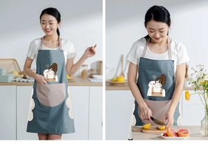 Waterproof kitchen apron in blue-grey featuring side hand towels and a large front pocket